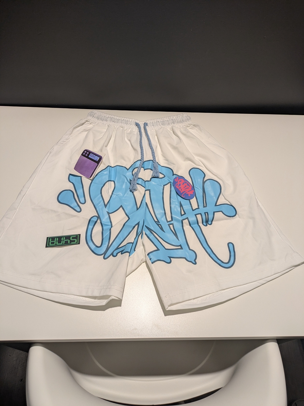Syna World White Graphic Shorts – Blue Graffiti Logo Streetwear